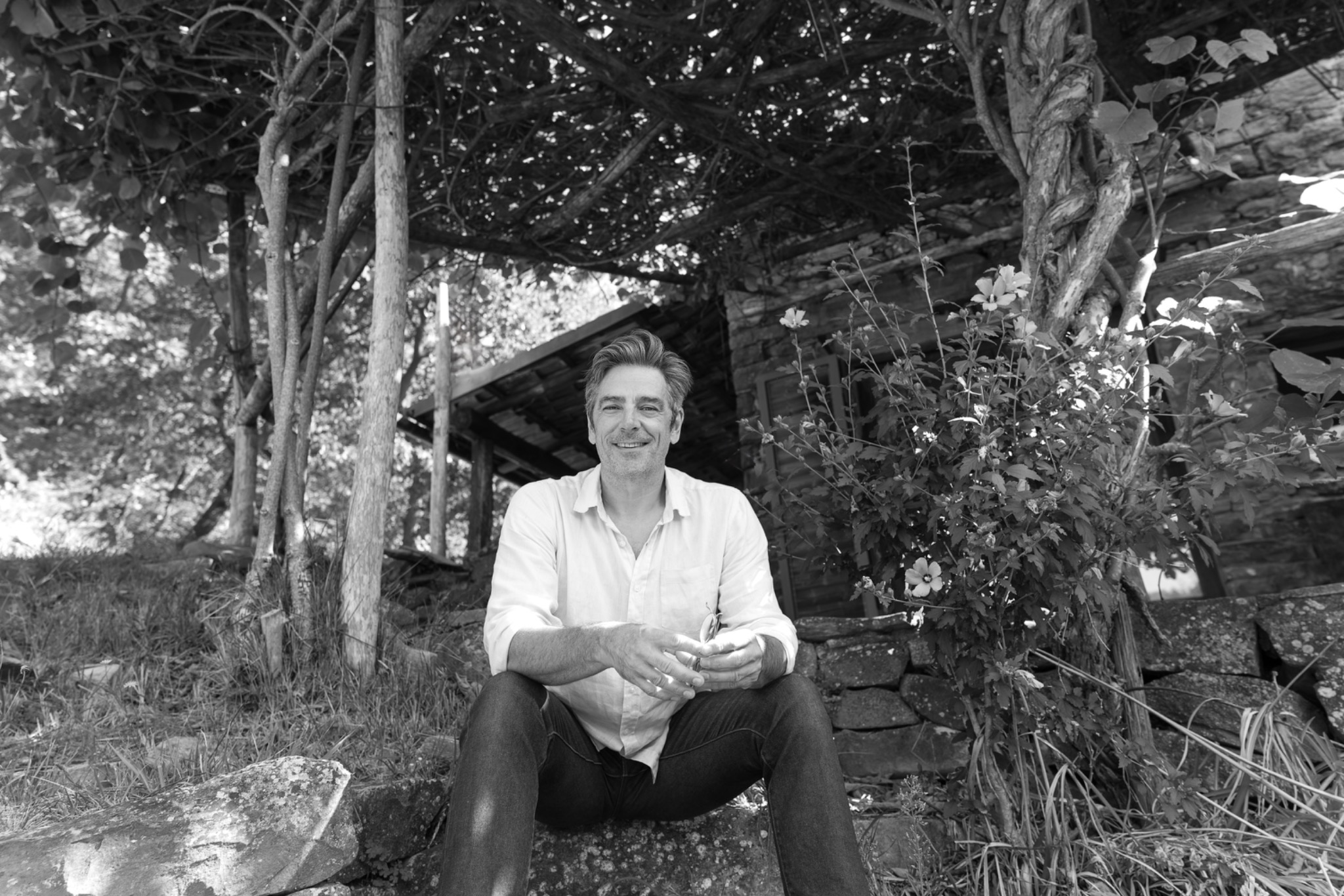 Anthony Reid seated outside Casa Scaiola in the Langhe